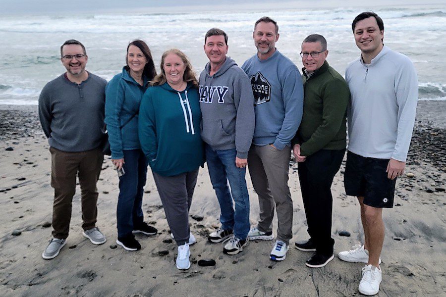 Board of Directors - Hawksoft User Group Board Memebers Standing on the Beach While Posing for a Photo on a Nice Day